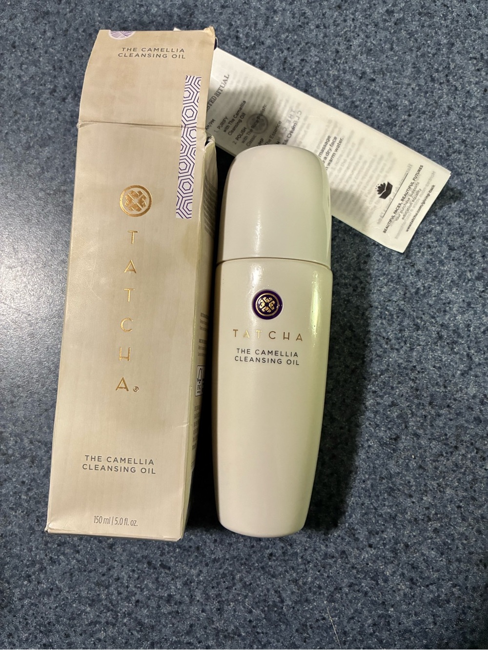 Tatcha Camellia Cleansing Oil Bottle in Cream and Gold Accents